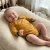 Glueckskind_wickelbody_sonnengelb_fuchs_merinowolle_Seide.webp